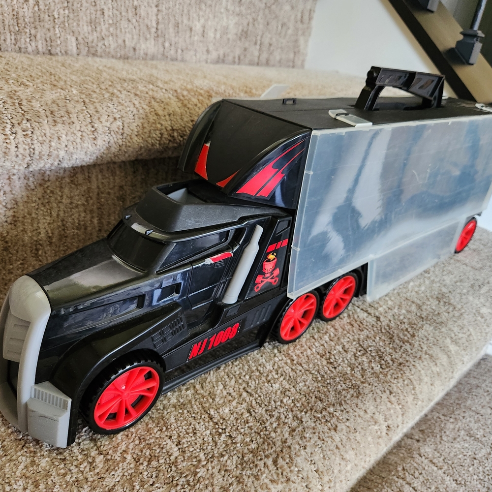 Black and Red Toy Truck with Trailer
